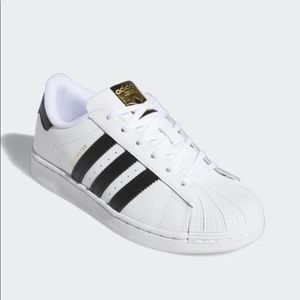 white tennis shoes with black stripes